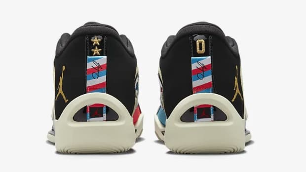Rear view of white, black, and red Jordan Tatum 1 sneakers.
